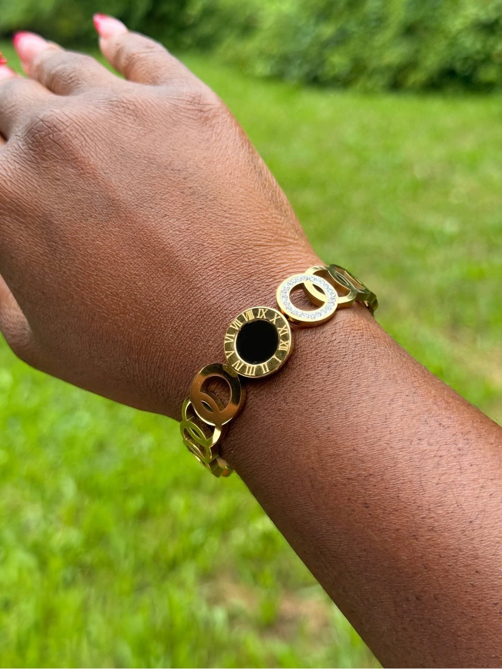Gold-Tone Roman Numeral Link Bracelet with Black Center